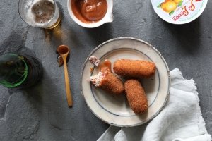 A plate of croquetas de jamon iberico on a white plate from Boqueria Spanish tapas bar in DC and NYC.